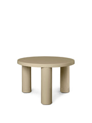 Beige round table with four legs on a white background