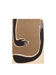 Abstract design rug with black hands on a brown and beige background