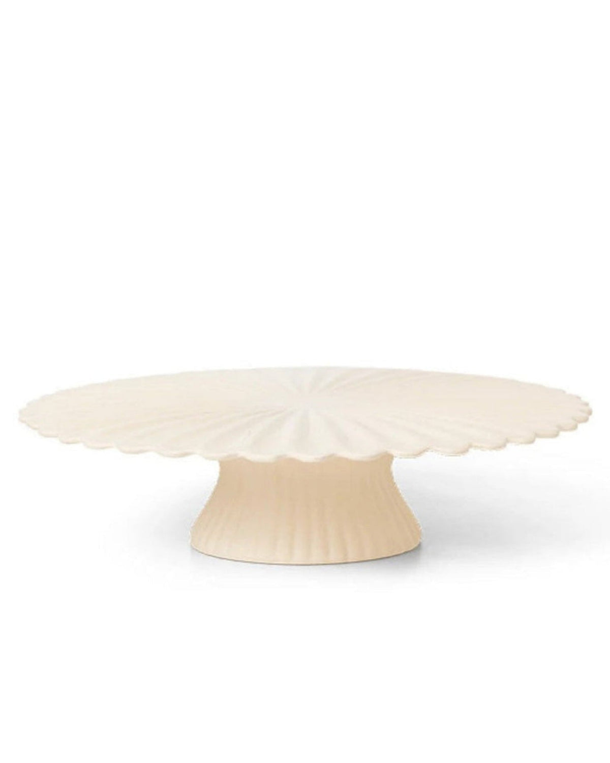 Decorative cake stand with scalloped edge on a white background