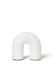 White arch-shaped vase on a white background
