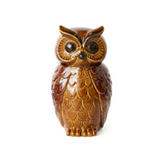 Brown owl-shaped container on a white background