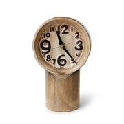 Decorative retro clock with a wooden base on a white background