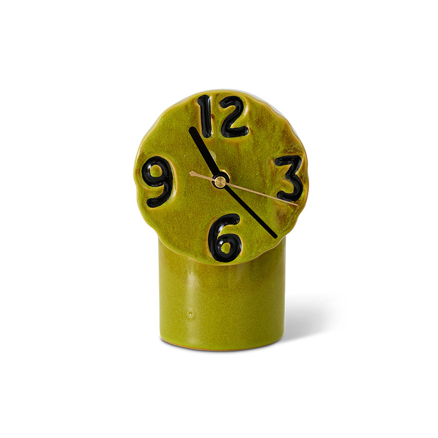 Green retro ceramic clock with black numbers on a white background
