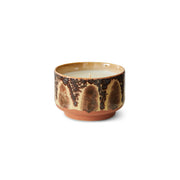 Ceramic candle with a crackled glaze on a white background
