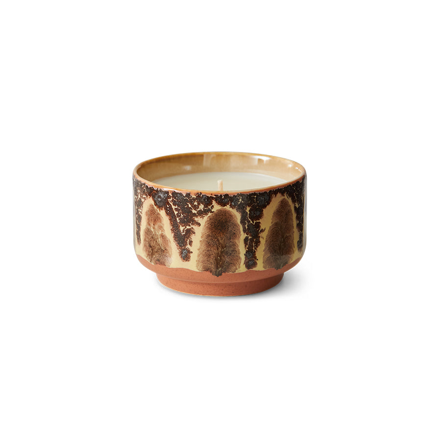 Ceramic candle with a crackled glaze on a white background