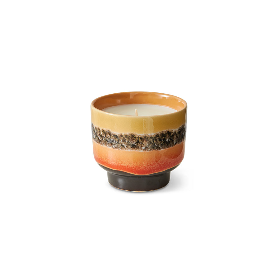 Ceramic candle with multicolored design on a white background