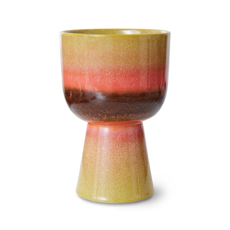 Multicolored ceramic plant pot with gradient design on a white background