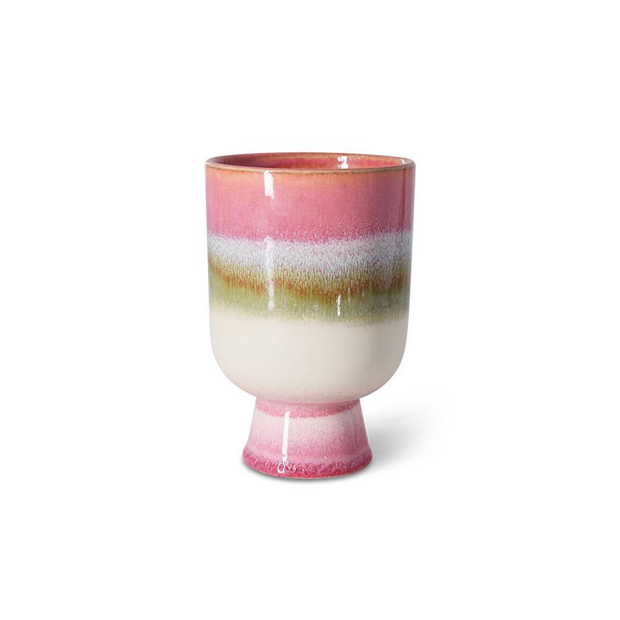 Ceramic plant pot with multicolored stripes on a white background