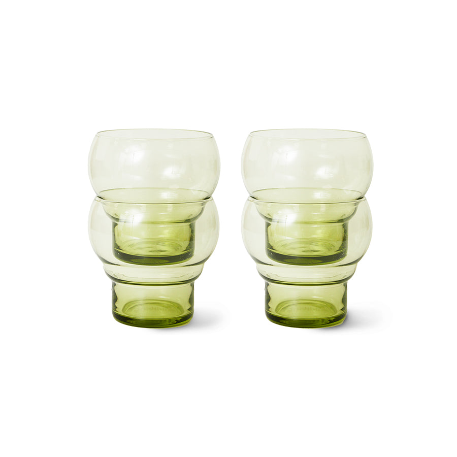 Two green glass tumblers on a white background