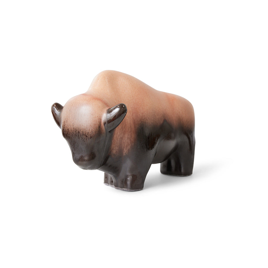 Wooden bison figurine on a white background