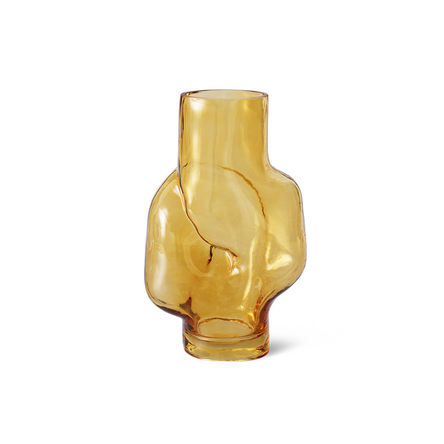 Amber glass vase with abstract design on a white background