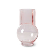 Pink glass vase on a white background