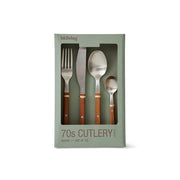 Packaged set of 70s cutlery with wooden handles on a white background