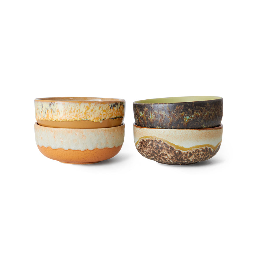 Set of four ceramic bowls with earthy tones on a white background