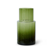Green glass vase on a white background
