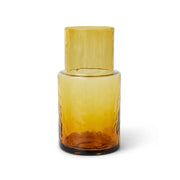 Amber glass bottle on a white background