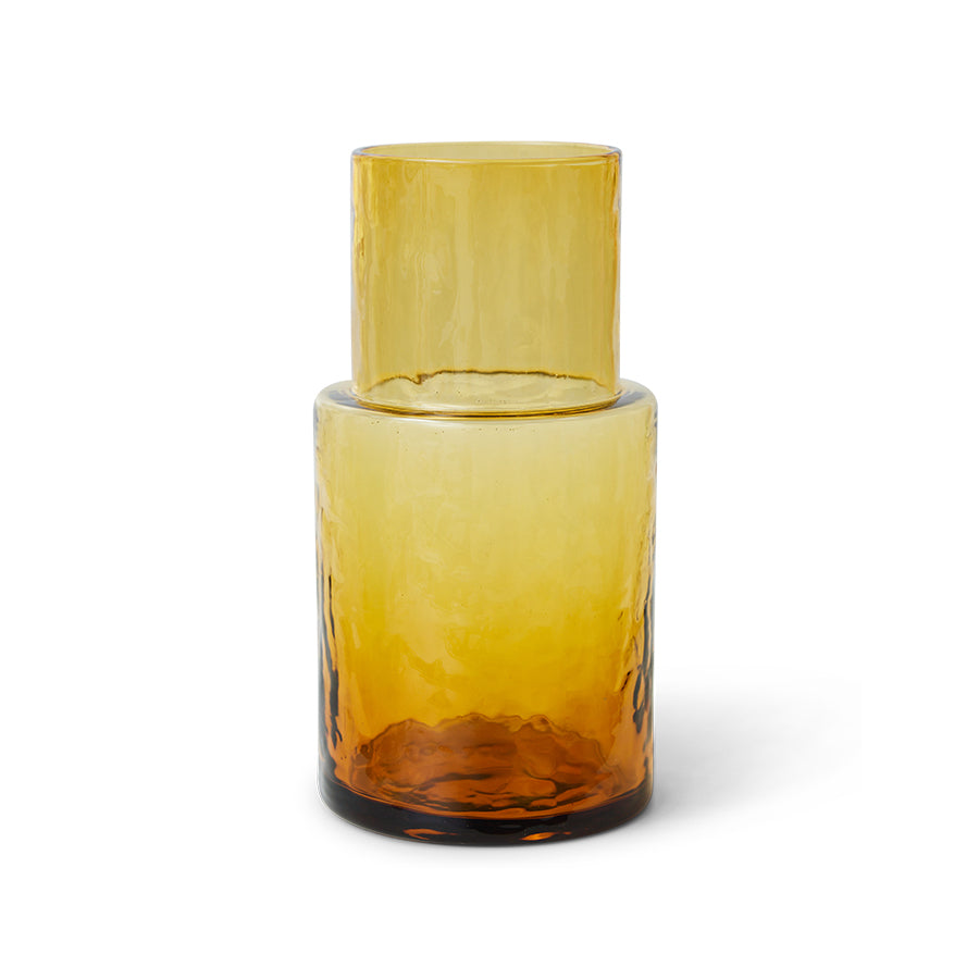 Amber glass bottle on a white background