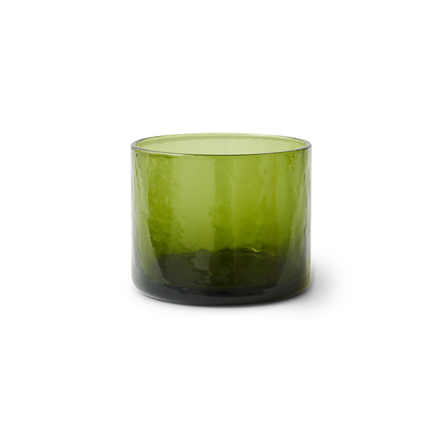 Green glass candle holder on a white background