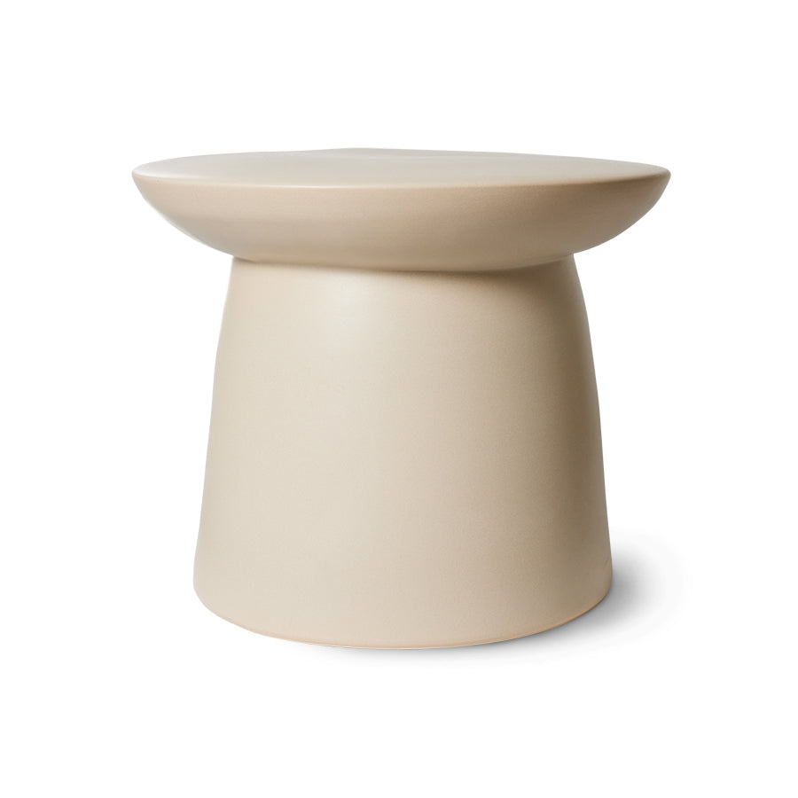 Beige stoneware side table on a white background