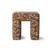 Small floral-patterned stool on a white background