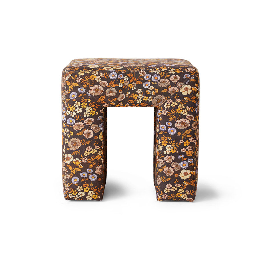 Small floral-patterned stool on a white background