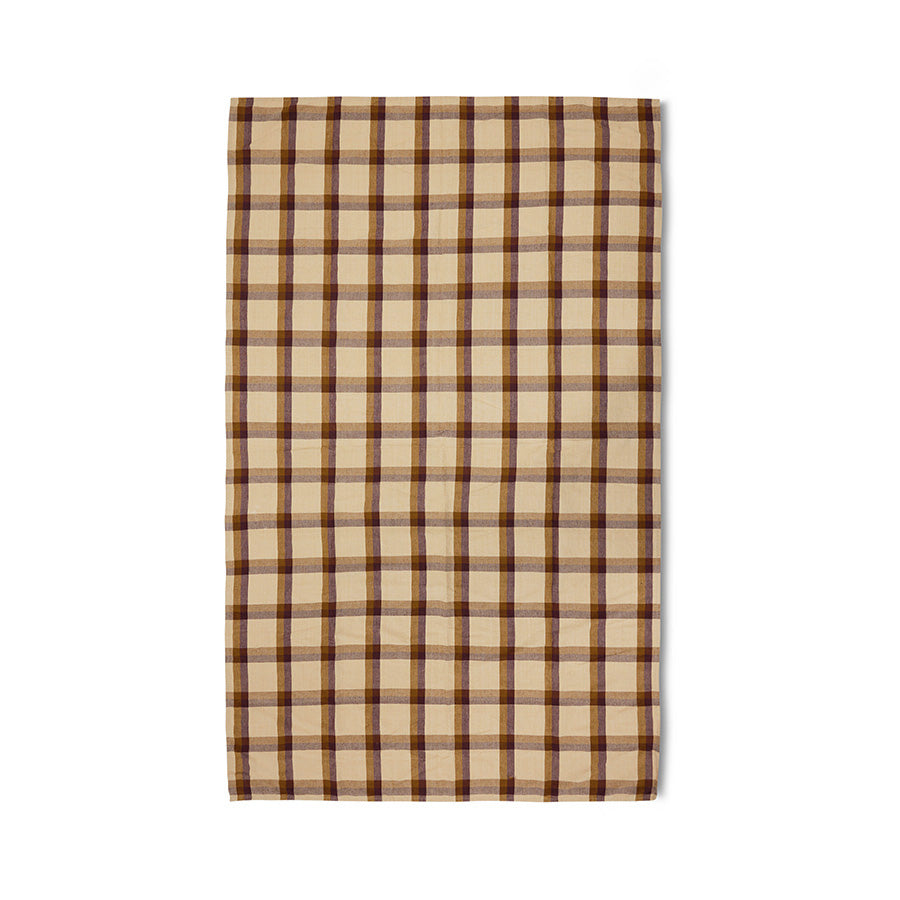 Beige and brown plaid table cloth on a white background