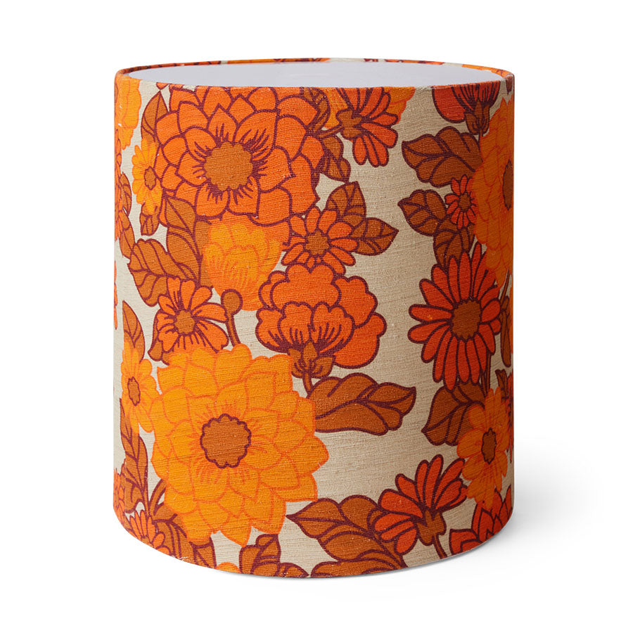 Cylindrical lamp shade with orange floral pattern on a beige background