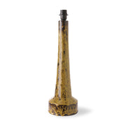Decorative table lamp base with a textured yellow base and black top on a white background
