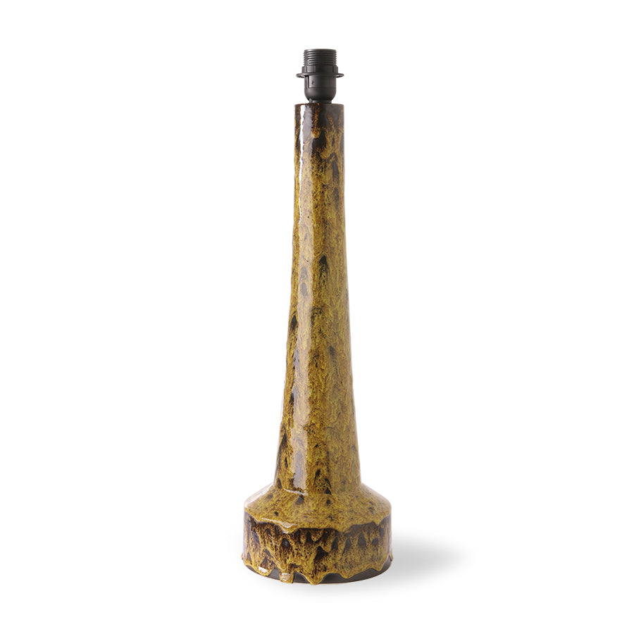 Decorative table lamp base with a textured yellow base and black top on a white background
