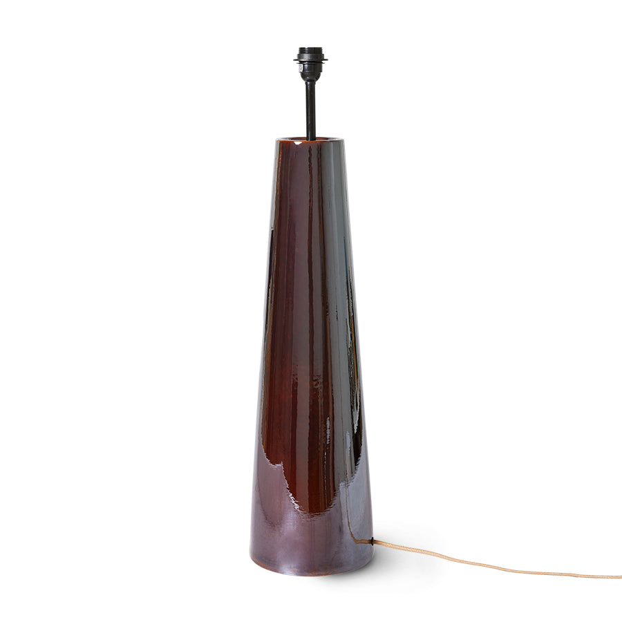 Tall, dark brown floor lamp base with a white background