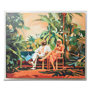Framed artwork of a couple sitting in a tropical setting with palm trees.